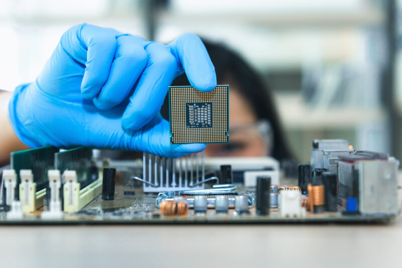 Close up portrait of computer engineer's hand is holding CPU's computer.